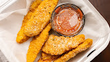 Crispy hand-breaded chicken tenders with marinara